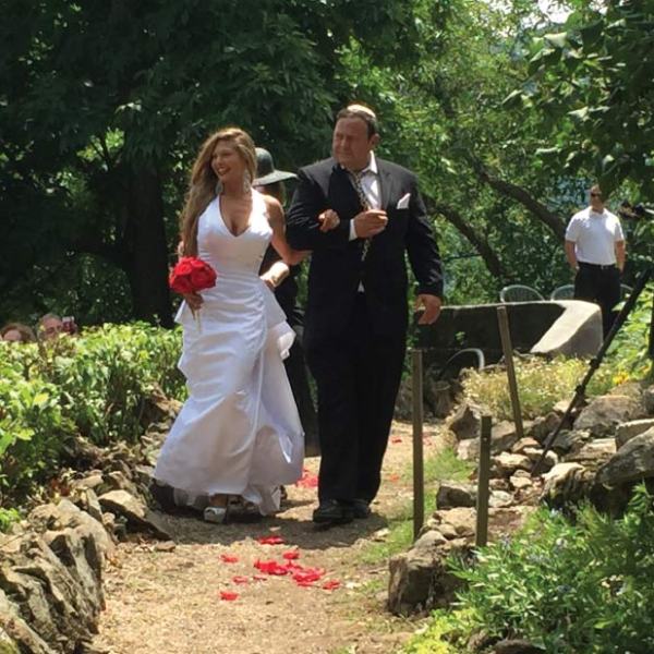 a group of people standing next to a tree