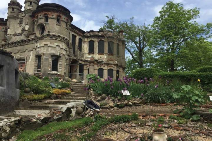a large stone statue in front of a building