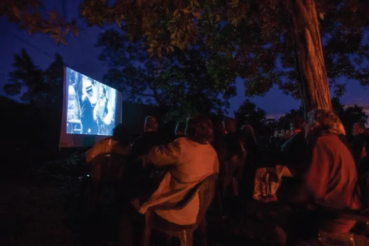 a group of people in a dark room