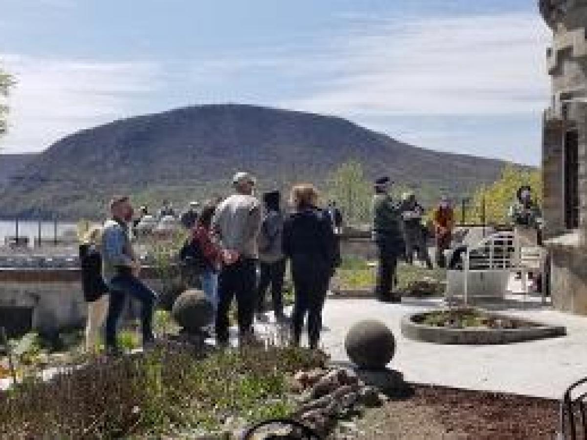 a group of people standing on top of a mountain