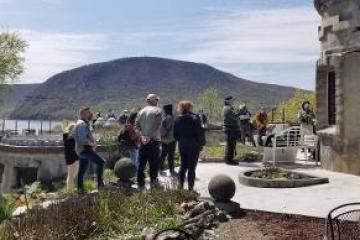 a group of people standing on top of a mountain