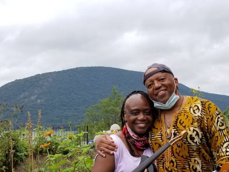 Gwen Laster, Damon Banks are posing for a picture