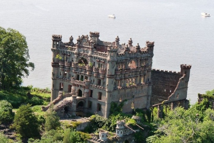 a castle surrounded by a body of water