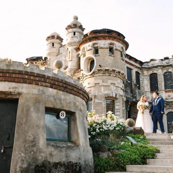 a large stone statue in front of a building