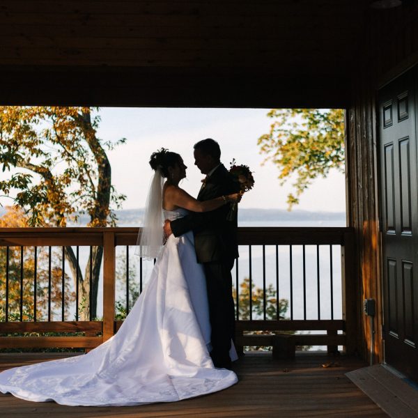 a person standing in front of a fence