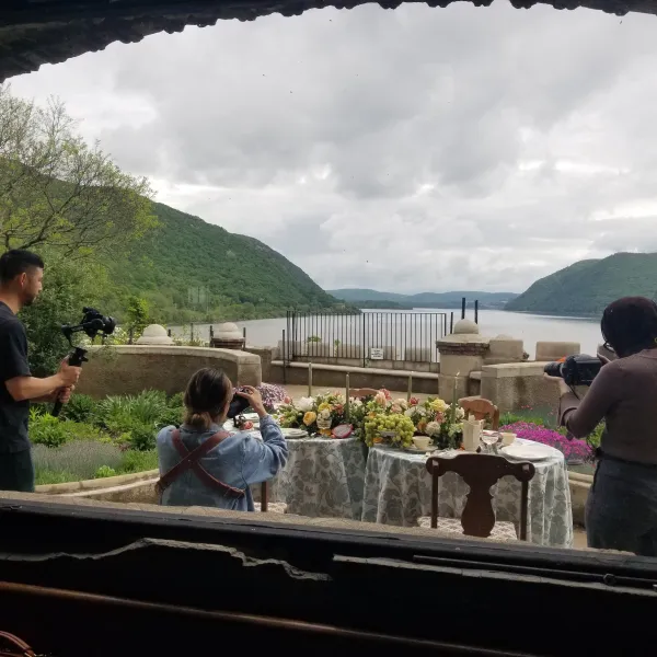 a group of people standing in front of a window